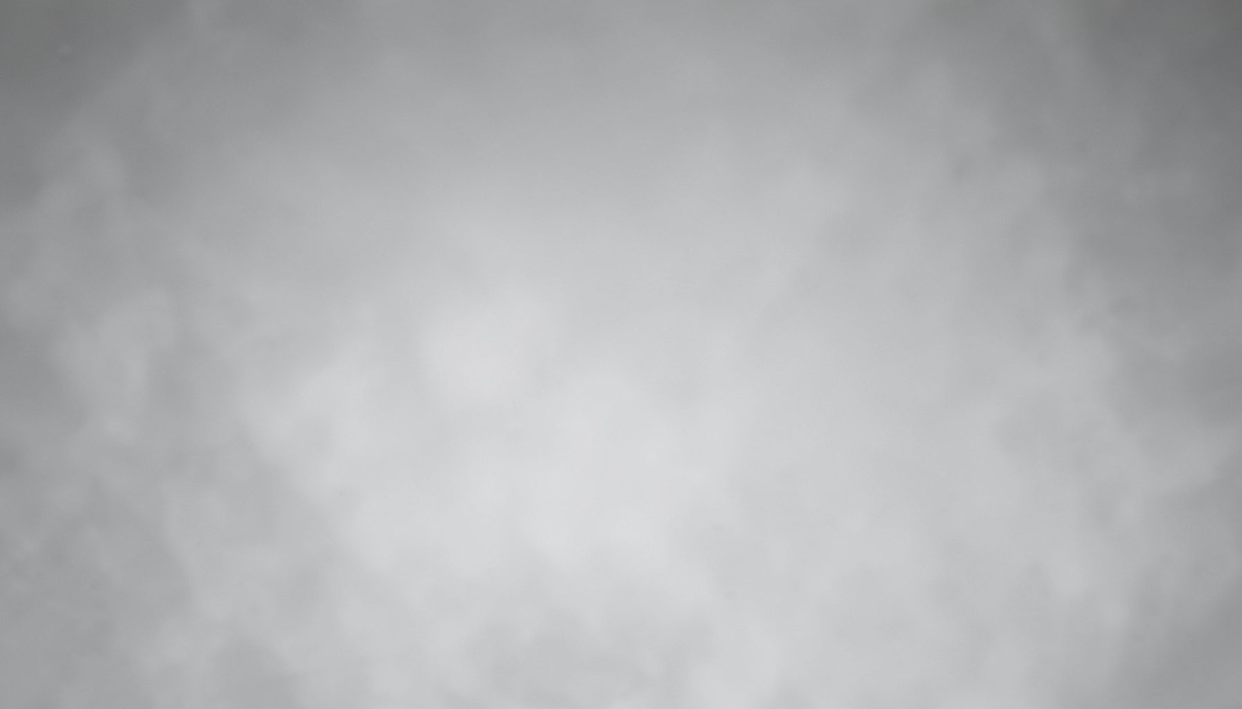 Soft gray gradient background with a subtle vapor-like haze, calm and professional atmosphere